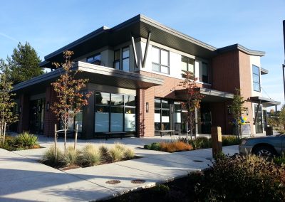 Two-storey commercial building with brick and grey cladding