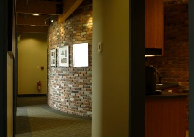 Corridor with a stone wall and wood trim