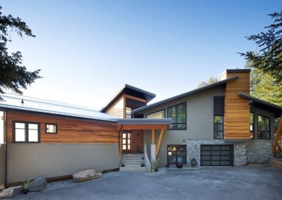 Contemporary house with wood siding and stone