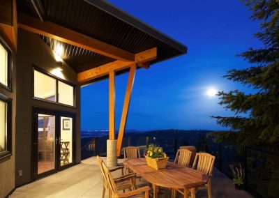 Covered deck with timber posts at dusk