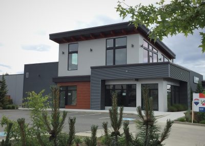 Two-storey commercial building with timber and dark panels
