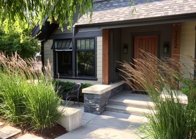 Front entry with stone steps and grasses