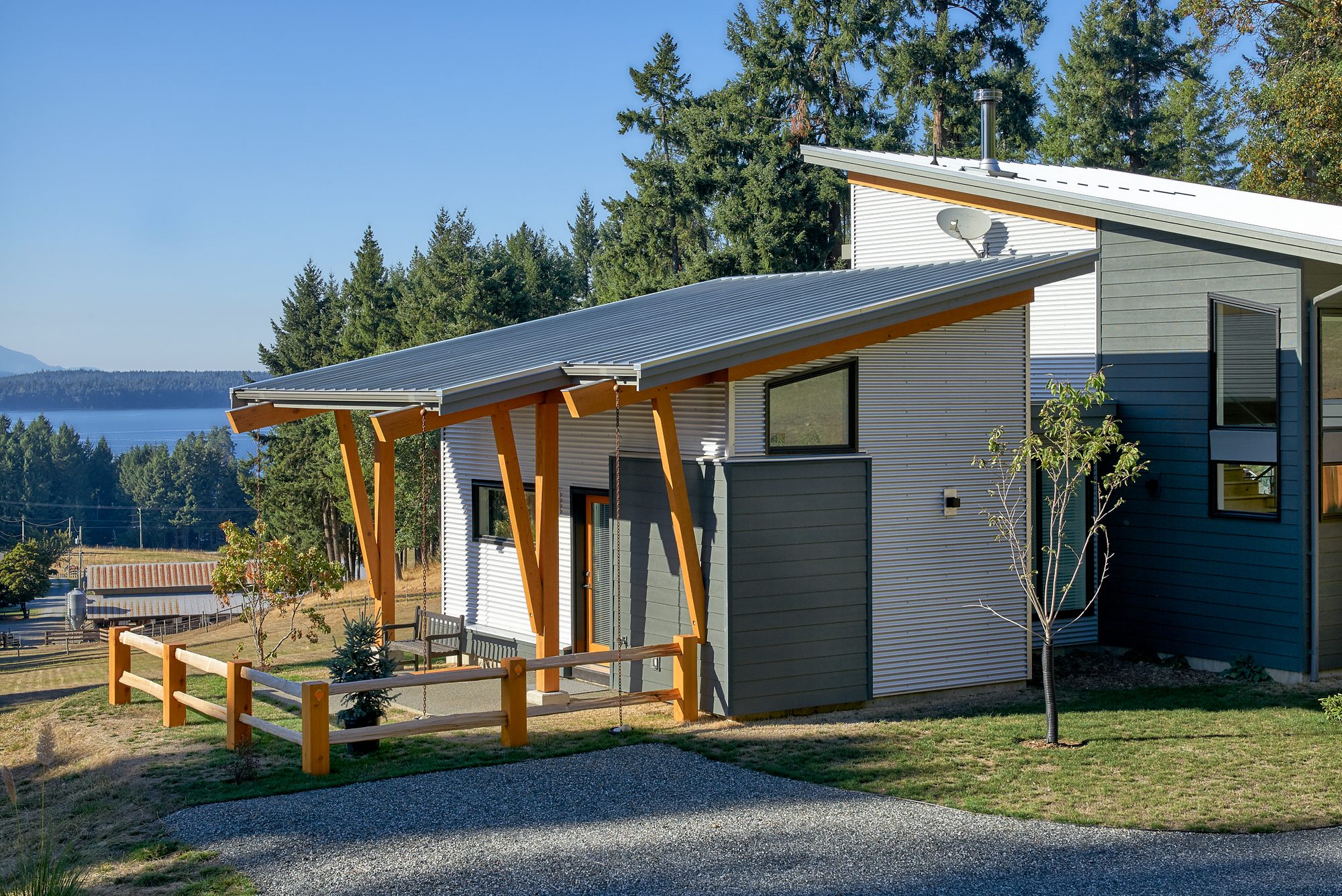 House with a shed roof and timber posts above the water