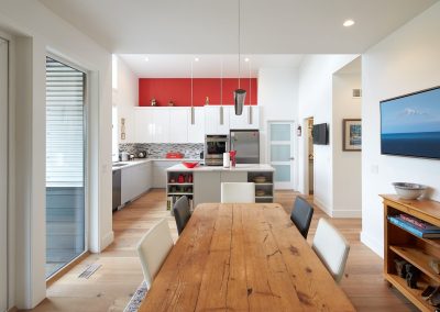 Kitchen and dining room with a long wood table